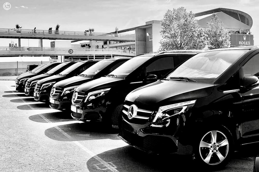 A close-up of a limo fleet parked in an organized row, symbolizing the extended reach and resources provided by affiliates.